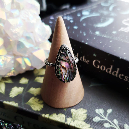 a ring with a pink stone on top