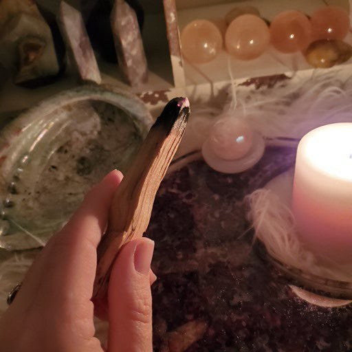 a person holding a candle in their hand