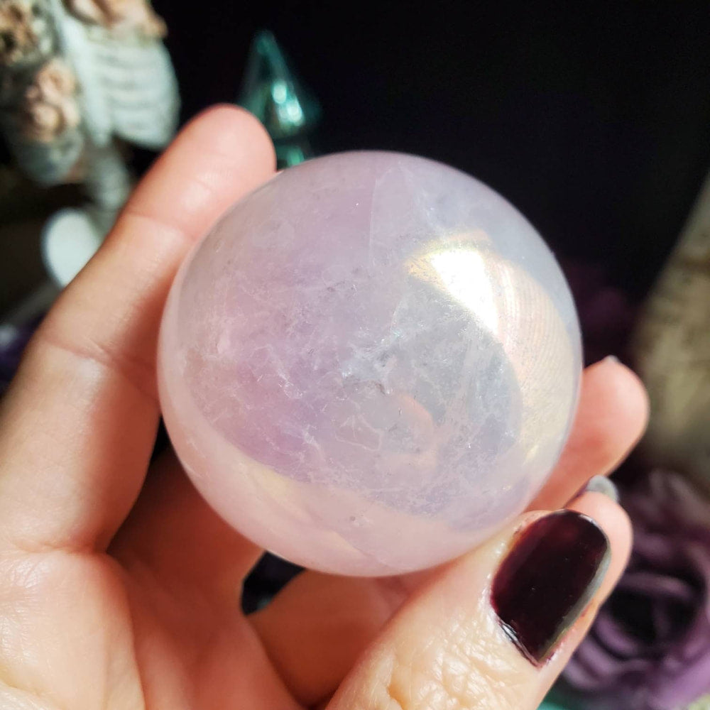 a person holding a large crystal ball