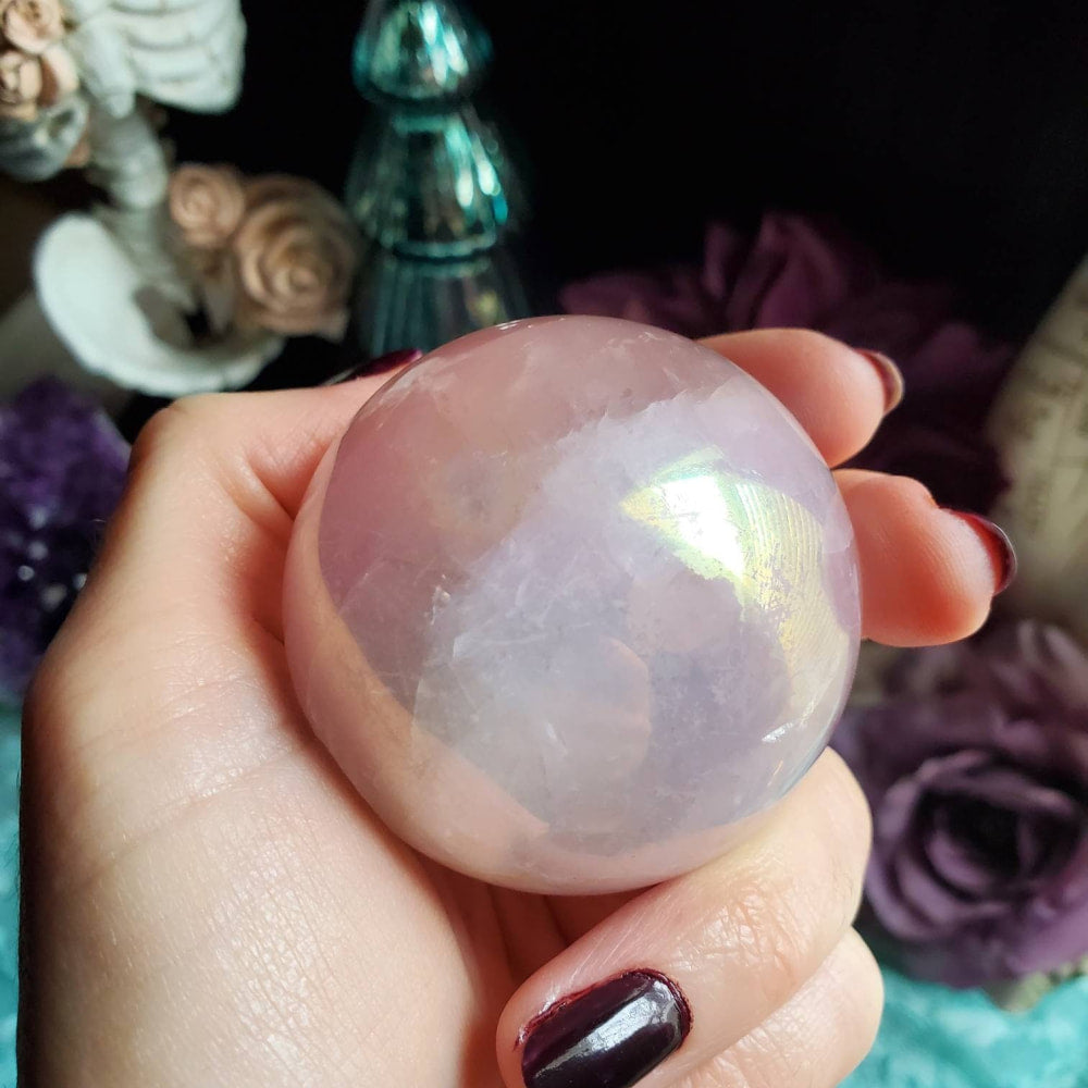 a person holding a large crystal ball