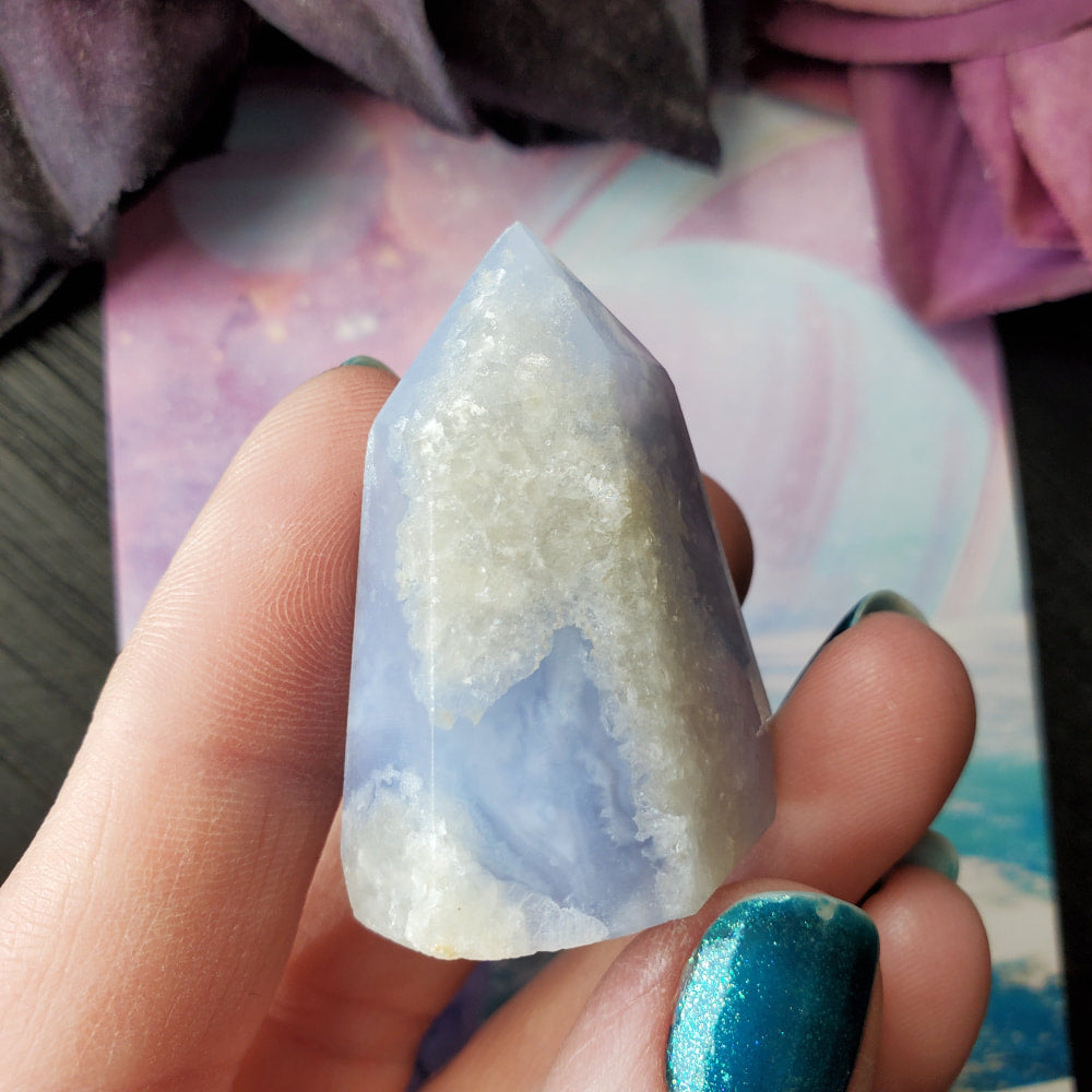 a person holding a blue and white quartz quartz