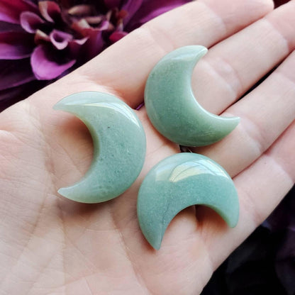 a pair of green jade crescent earrings