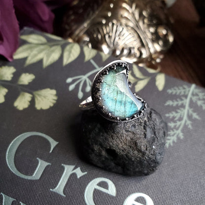 a ring with a blue stone on top