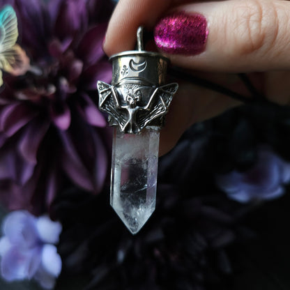 Crystal pendant with an ornate silver bat-winged cap.