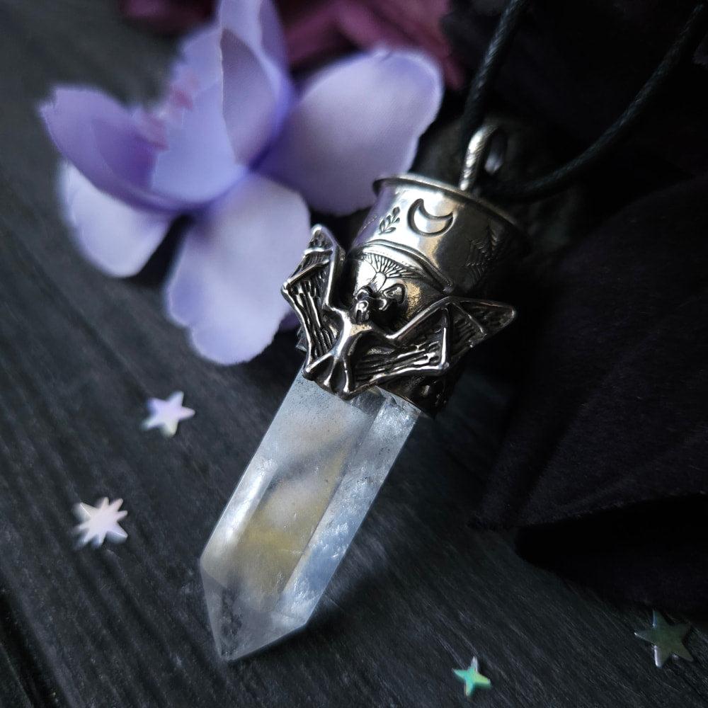 Crystal pendant necklace with a bat-winged decorative cap.