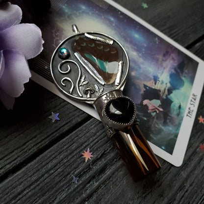 a silver ring with a star and a phone