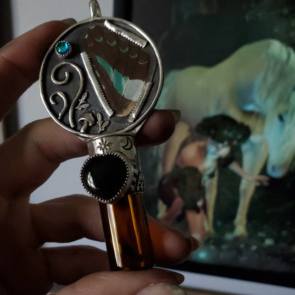 a person holding a bottle opener with a horse in the background